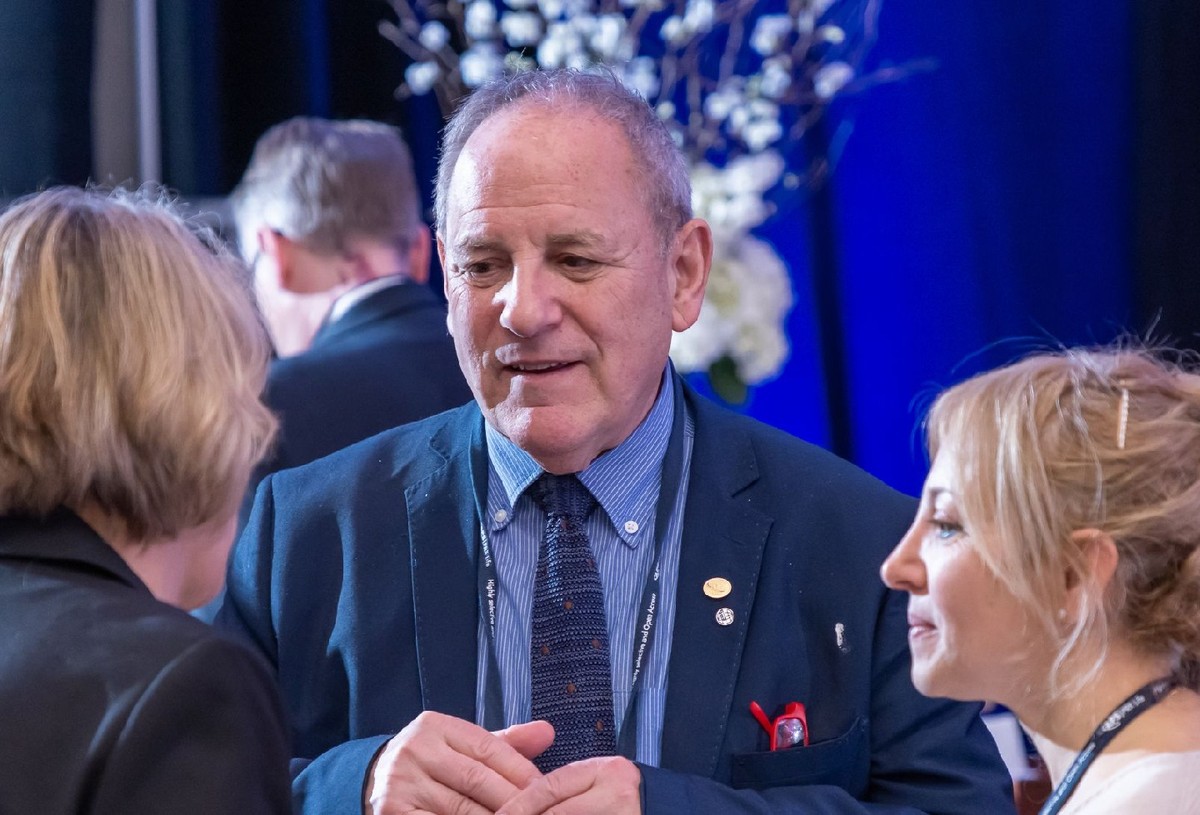 Photo of 3 people in conversation