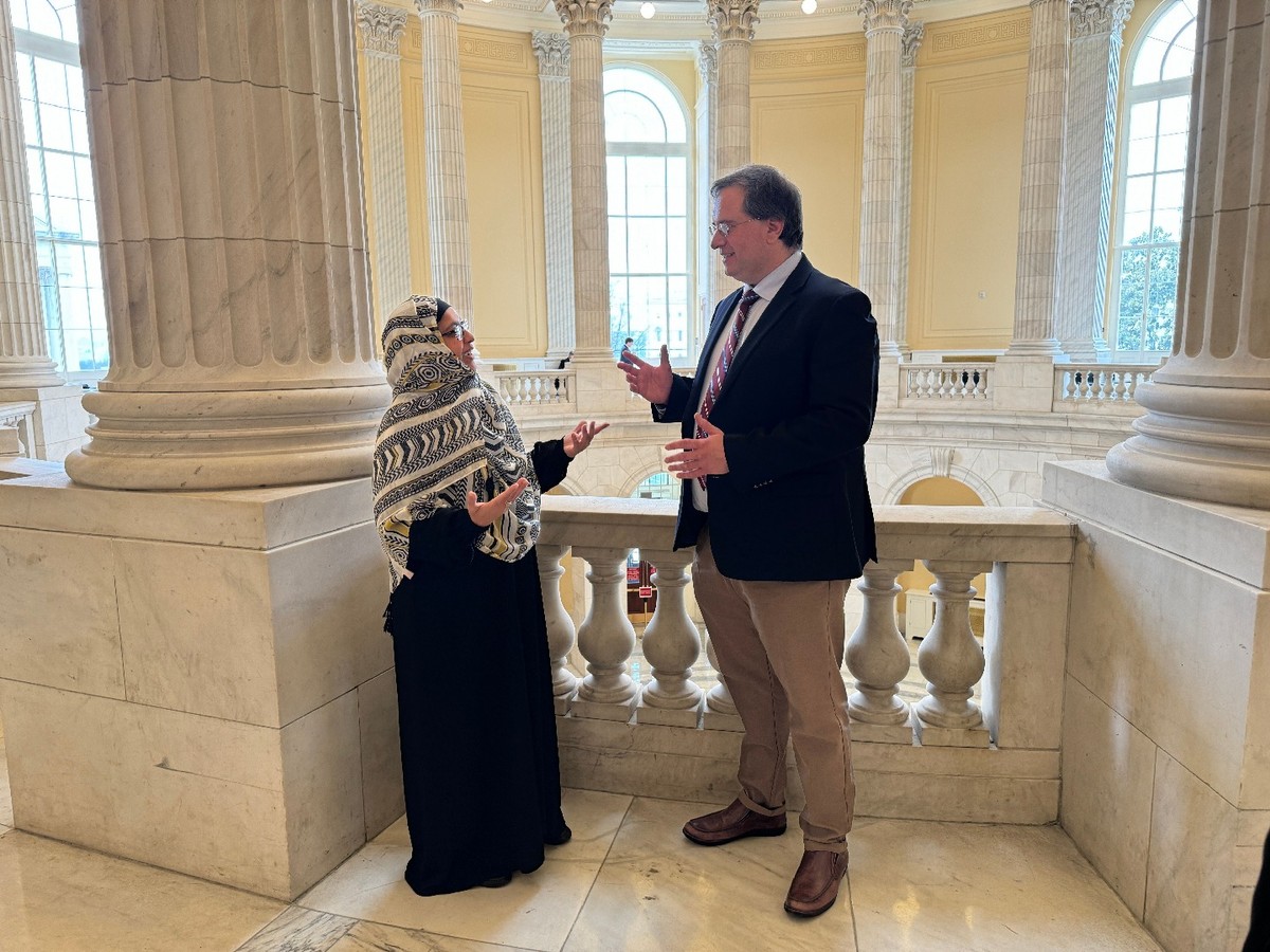Two people speaking in a government building